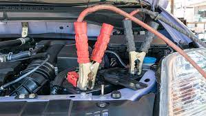 What keeps a car battery from falling out?