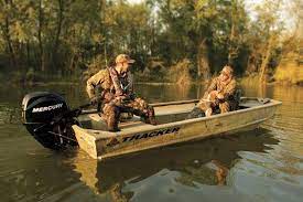 What kind of clothing should I bring with me when I go hunting from a boat?