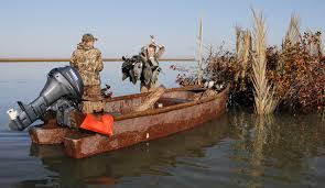 What safety precaution when hunting from a boat?