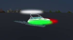 Which course of action should you take if you're approaching another boat at night and notice a green and white light?
