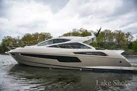 Who is the current owner of the Miller Time Boat on Lake of the Ozarks?